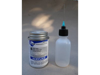 Fig-3. Scigrip 4 acrylic adhesive cement with applicator.
